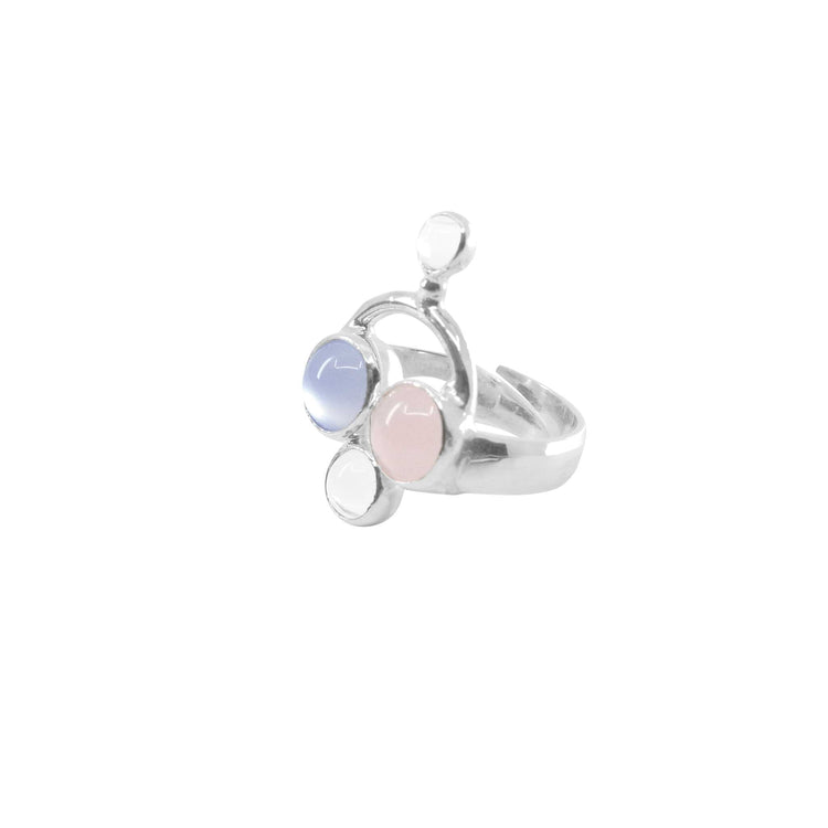 The Kaora Sandara Jewelry Happy Parents Ring features sterling silver with light blue chalcedony, pale pink rose quartz, and a white crystal in a modern abstract design—a stunning piece of motherhood jewelry.