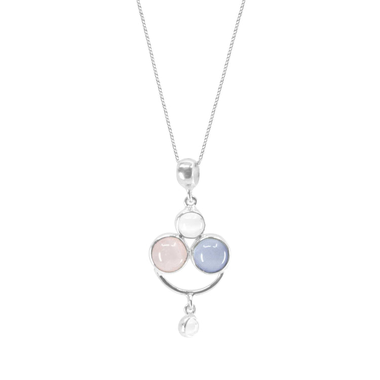 The Happy Parents Pendant by Kaora Sandara Jewelry is a sterling silver necklace with crystal, chalcedony, and rose quartz gems in a triangular setting, plus a small clear stone dangling below.