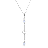 The State Pendant by Kaora Sandara Jewelry features sterling silver, crystal, and chalcedony in a vertical design with two round light blue stones joined by silver bars and rings on a delicate chain for tranquility and balance.