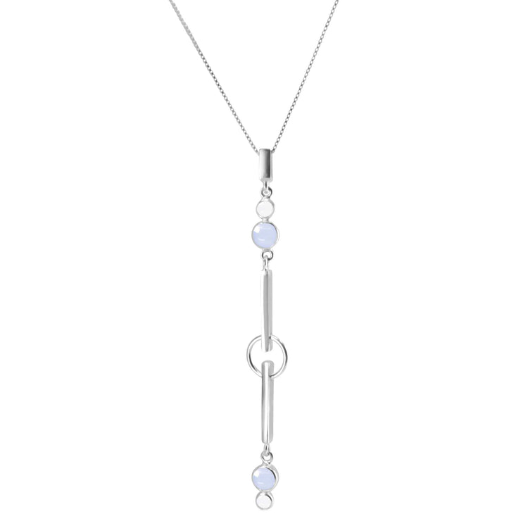 The State Pendant by Kaora Sandara Jewelry features sterling silver, crystal, and chalcedony in a vertical design with two round light blue stones joined by silver bars and rings on a delicate chain for tranquility and balance.