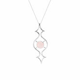 The Quantum Shift NEW Pendant by Kaora Sandara Jewelry is a sterling silver 925 necklace with an openwork design, a round Rose Quartz at its center, and comes in size S. The pendant hangs from a fine chain against a white background.