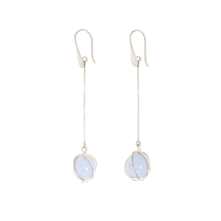 Kaora Sandara Jewelry's Silver Earhooks The Wave showcase graceful chains with round pale blue Chalcedony sphere gemstones in minimalist wire settings—a refined accent for any jewelry collection.