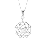 The Expansion Pendant by Kaora Sandara Jewelry is crafted in Sterling Silver, showcasing a geometric flower design with a central rhinestone crystal and a smaller white stone above it, suspended elegantly on a fine chain.