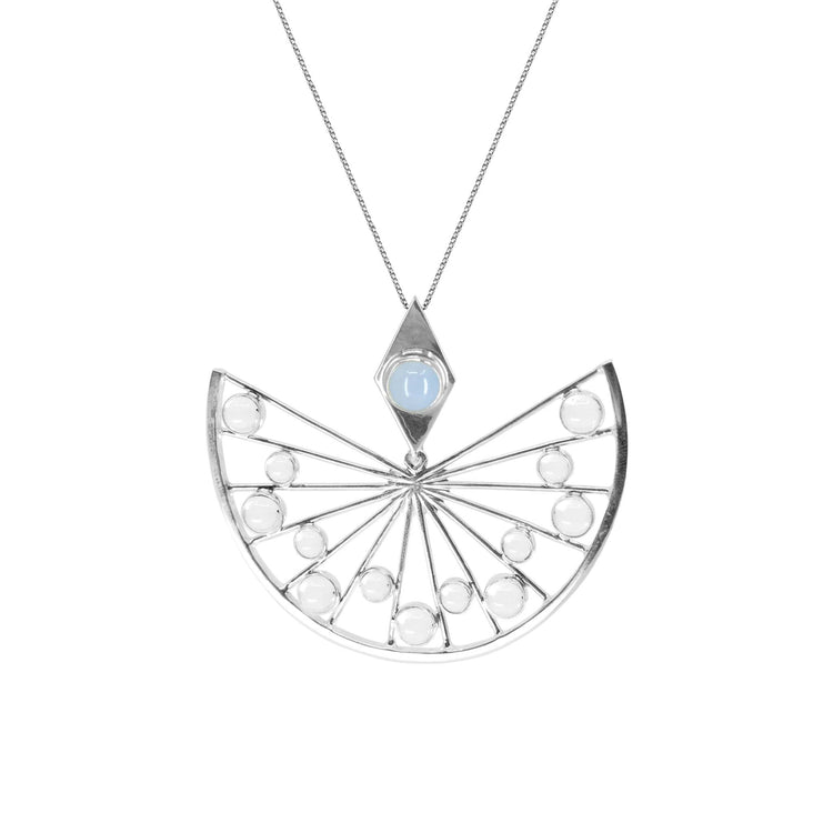 The Higher Self Pendant by Kaora Sandara Jewelry features a geometric semicircle Sterling Silver design with crystal, light blue Chalcedony, radiating lines, diamond-shaped setting, and small round accents on a fine chain.