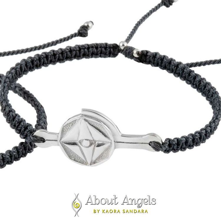 A silver male bracelet on a dark grey string with "Life Mission" code by Kaora Sandara Jewelry, shown on a white background above the "About Angels by Kaora Sandara" logo.
