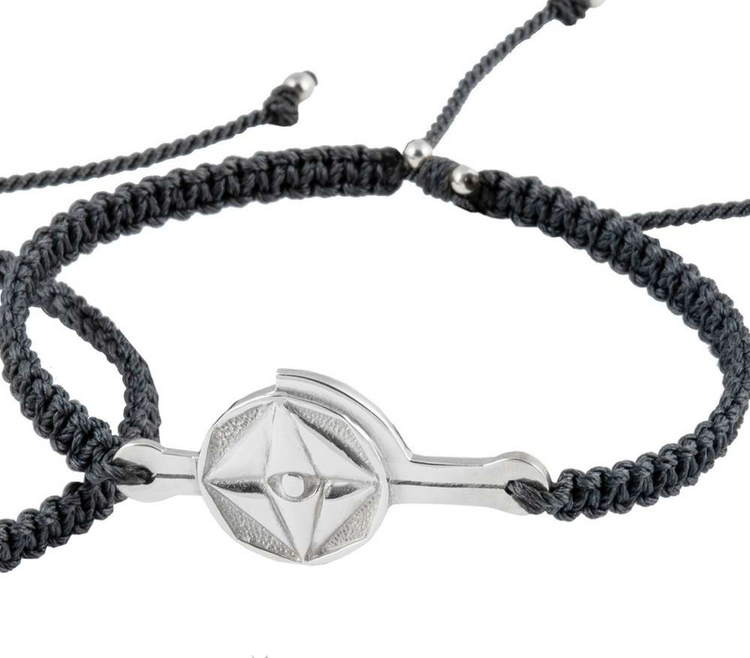 A silver male bracelet on a dark grey string with "Life Mission" code by Kaora Sandara Jewelry, shown on a white background above the "About Angels by Kaora Sandara" logo.
