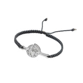 The Silver Male Bracelet On Dark Grey String With Code Transition by Kaora Sandara Jewelry features a braided cord, an adjustable knot, and a sterling silver star-shaped geometric charm at the center.