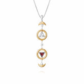The Resource Pendant by Kaora Sandara Jewelry features two gold-plated crescent moons, two gold circles with crystal and garnet gems, all suspended vertically on a sterling silver chain.