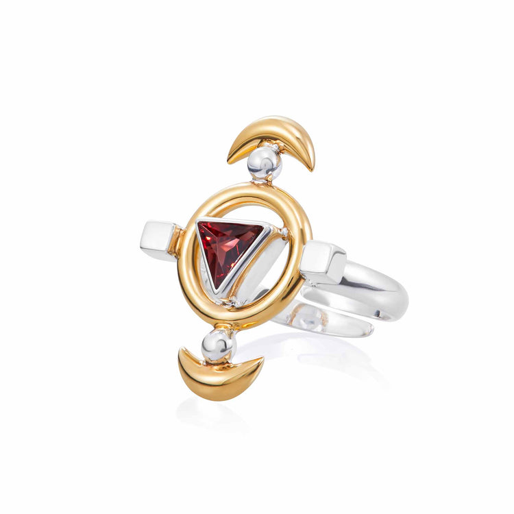 The Kaora Sandara Jewelry Resource Ring features sterling silver, gold-plated circular and crescent designs, and a central triangular red garnet for a modern geometric look.