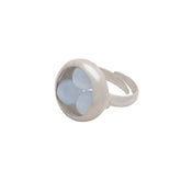 The Kaora Sandara Jewelry Silver Ring Crystal Peace with Chalcedony (Size L) features sterling silver with a clear round dome holding three pale blue chalcedony ovals in a triangular pattern.