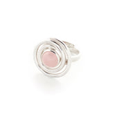 The Silver Ring Open Spiral with Rose Quartz - Size S by Kaora Sandara Jewelry features a 925 silver spiral design and a round rose quartz at the center, symbolizing unconditional love, shown on a white background.