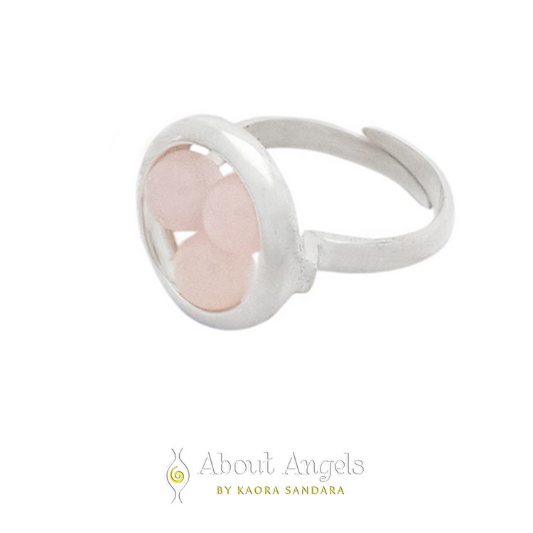 The Silver Ring Crystal Peace with Rose Quartz - Size S by Kaora Sandara Jewelry features three round, pale pink Rose Quartz stones in a sterling silver 925 bezel, shown with the "About Angels by Kaora Sandara" logo on white.