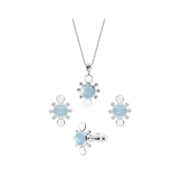 Kaora Sandara Jewelry’s Bliss Earhooks are Sterling Silver earrings in size L, adorned with crystal and light blue Chalcedony stones, each encircled by silver beads in a sunburst pattern.
