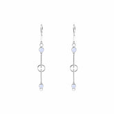 The Silver Earhooks State earrings by Kaora Sandara Jewelry feature crystal and chalcedony gemstones, with long silver dangles, round light blue stones, and a blend of circular and bar elements for a tranquil look.