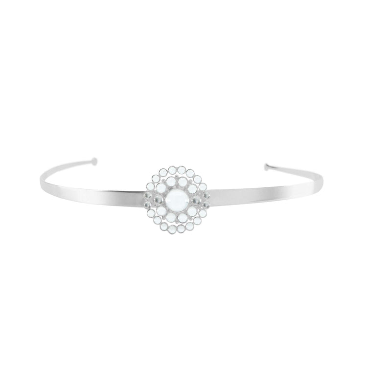 The Purity Headband by Kaora Sandara Jewelry features a sterling silver band with a central circular crystal design, exuding purity and elegance. Displayed on a white background.