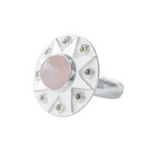 The Silver Ring Unconditional Love by Kaora Sandara Jewelry features a large round rose quartz center with a starburst design and small peridot accents around the edge, all crafted in sterling silver 925.