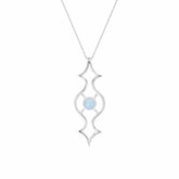 The Quantum Shift NEW Pendant by Kaora Sandara Jewelry is a sterling silver necklace with an ornate symmetrical design and a central light blue oval chalcedony, hanging from a delicate chain. Size S.