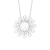 The "I am in Everything Pendant" by Kaora Sandara Jewelry features sterling silver and crystal, with a sunburst design of radiating circles and thin lines, evoking healing energy against a crisp white background.