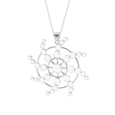 The Perfection of Life Pendant by Kaora Sandara Jewelry features concentric circles and radiating lines in sterling silver with crystal, creating a geometric sunburst design accented with round beads.