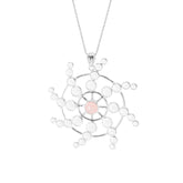 The Perfection of Life Pendant by Kaora Sandara Jewelry features sterling silver shaped in a geometric starburst, with a central Rose Quartz and crystals—a radiant symbol of life's perfection.
