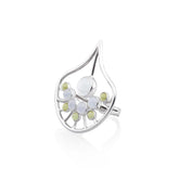 The Body Relaxation Ring by Kaora Sandara Jewelry is a sterling silver piece featuring crystal, chalcedony, and peridot in an open artistic leaf design to promote positive energy flow.