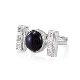 The Health Formula Ring by Kaora Sandara Jewelry is crafted in sterling silver 925, showcasing a central round black agate and two rectangular sections, each adorned with three square clear crystals.