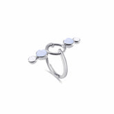 The State Ring by Kaora Sandara Jewelry features sterling silver with crystal and chalcedony, showcasing three light blue gemstones in a modern, minimalist open circular design that symbolizes inner balance.