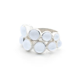 The Silver Ring The Dance with Chalcedony by Kaora Sandara Jewelry features multiple round, light blue chalcedony stones of varying sizes in an organic cluster design—a unique sterling silver piece.