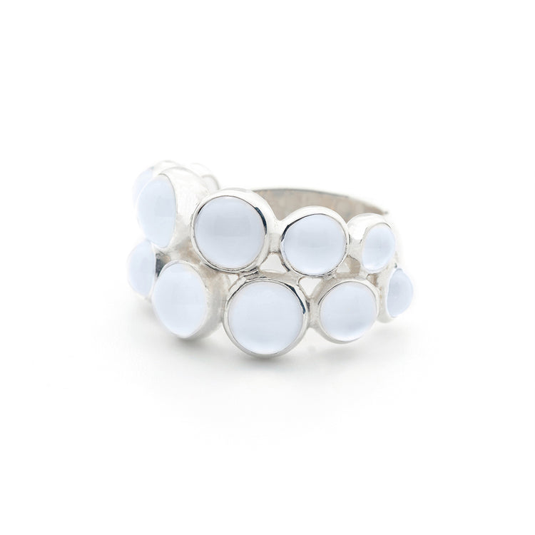 The Silver Ring The Dance with Chalcedony by Kaora Sandara Jewelry features multiple round, light blue chalcedony stones of varying sizes in an organic cluster design—a unique sterling silver piece.