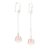 Kaora Sandara Jewelry's I'M A Queen Earhooks are sterling silver earrings with long, thin chains and round rose quartz stones in petal-shaped settings at the ends.
