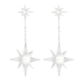 Kaora Sandara Jewelry’s Silver Earstuds on Chain Magic Star feature dangling eight-pointed stars with crystal sphere gemstones, linked by a short chain to smaller matching stars at the top.