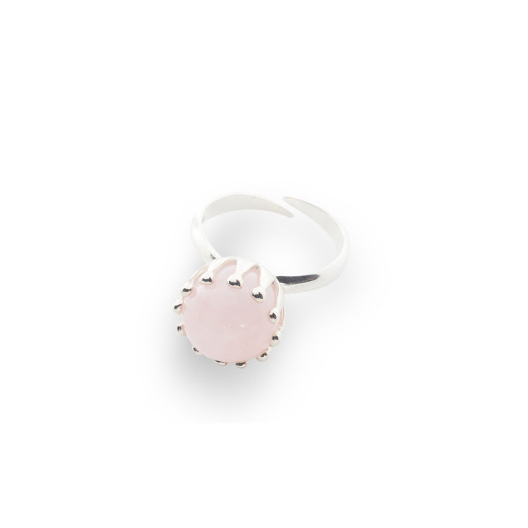 The "Silver Ring I'M A Queen with Rose Quartz - Size S" by Kaora Sandara Jewelry features a round pale pink rose quartz in a claw setting, crafted in sterling silver with an adjustable band and shown on a white background.