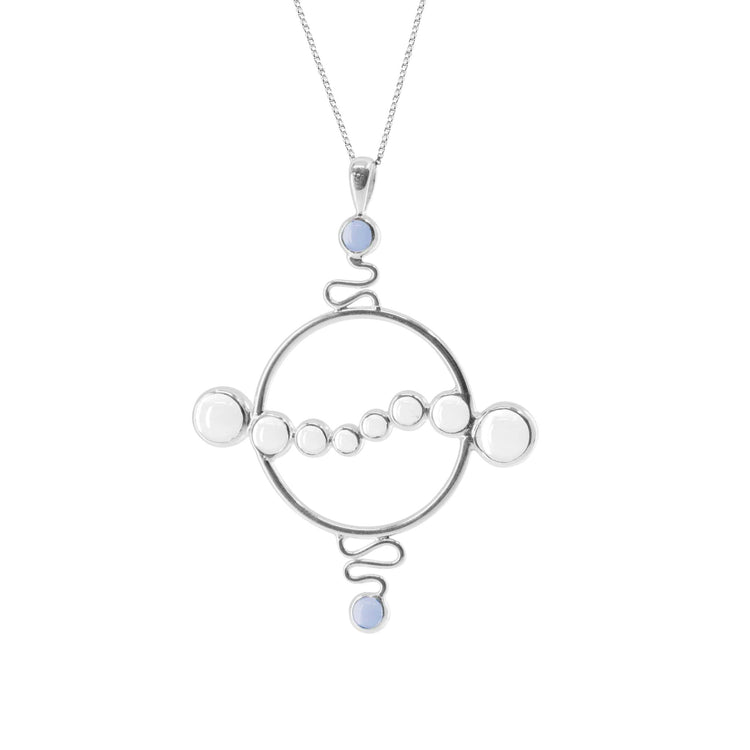 The Soul Potential Pendant by Kaora Sandara Jewelry is a sterling silver necklace featuring a large circular frame with chalcedony and crystal beads, connected by decorative wire details.