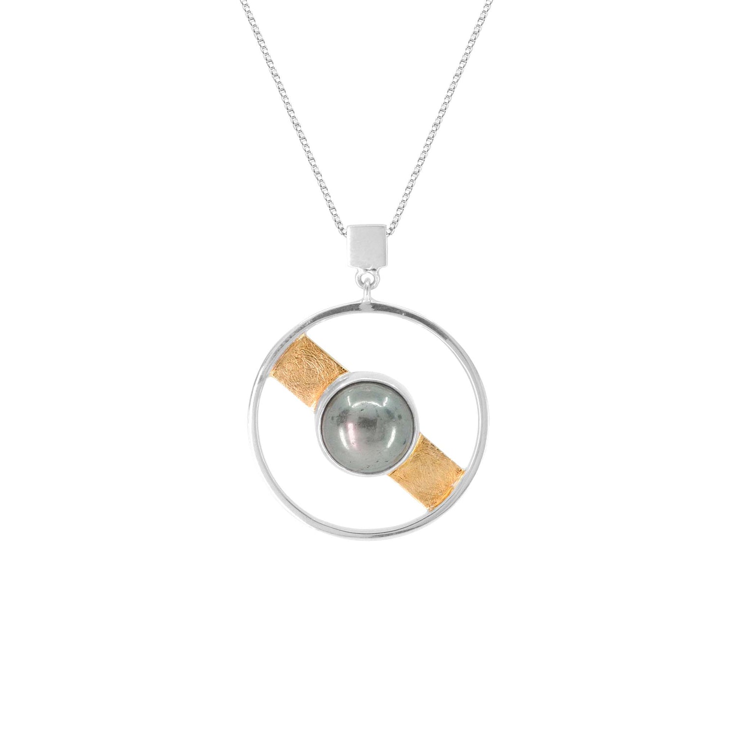 The Animus Pendant by Kaora Sandara Jewelry features a sterling silver circle, a central pyrite sphere, and a diagonal gold-plated band—celebrating masculine qualities in elegant jewelry.