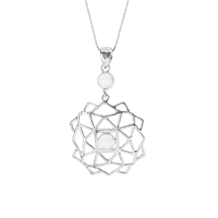 The Expansion Pendant by Kaora Sandara Jewelry is crafted in Sterling Silver, showcasing a geometric flower design with a central rhinestone crystal and a smaller white stone above it, suspended elegantly on a fine chain.