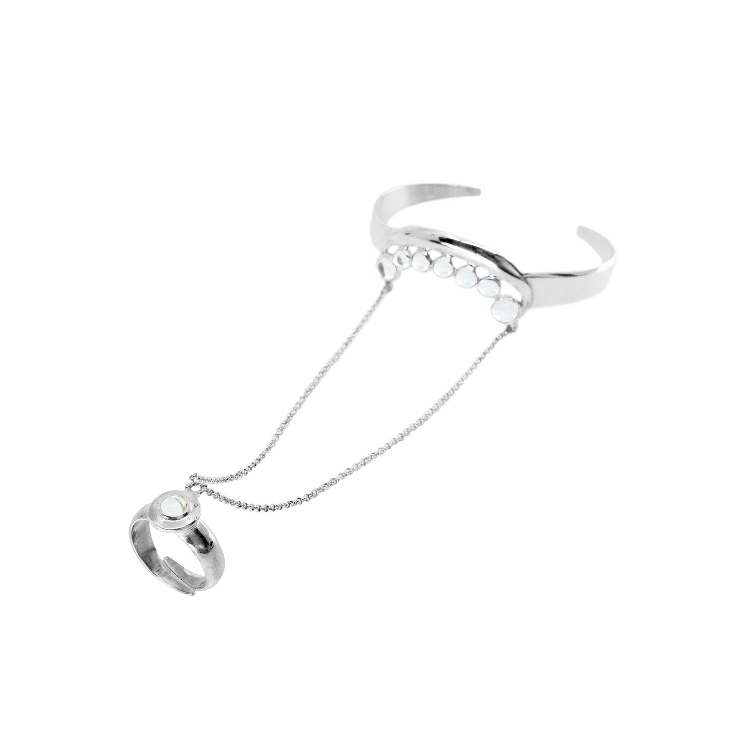 The Fifth Dimension Hand Chain by Kaora Sandara Jewelry features a sterling silver 925 cuff with crystal spheres, joined to a matching ring by two delicate chains for an elegant look.