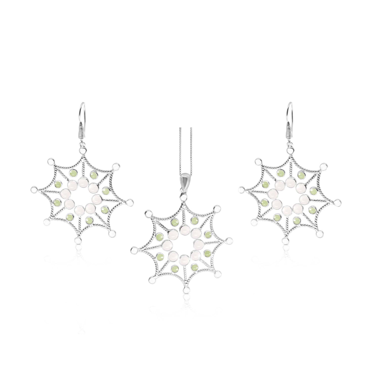 The Freedom from the Ego Pendant set by Kaora Sandara Jewelry features a sterling silver necklace and earrings with snowflake-shaped pendants, adorned with rose quartz and peridot crystals.