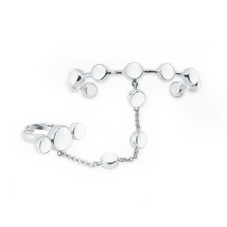 The Silver Hand Chain Crystal Path by Kaora Sandara Jewelry features two rings linked by a delicate chain, each adorned with crystal sphere gemstones for a modern, minimalist look with gemstone elegance.