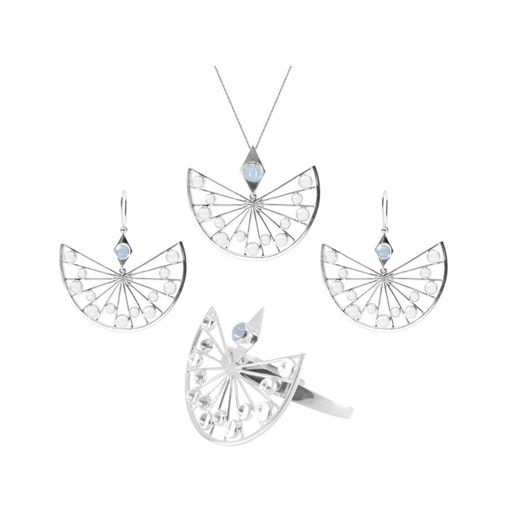 The Higher Self Pendant from Kaora Sandara Jewelry is crafted in sterling silver with a fan-like design, circular details, and features a blue chalcedony and crystal accent. The piece is displayed against a white background.