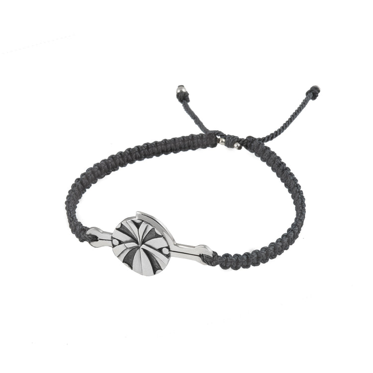 The Kaora Sandara Jewelry Silver Male Bracelet features a round sterling silver 925 “Abundance” charm with a geometric sunburst design on a dark grey, braided adjustable string.