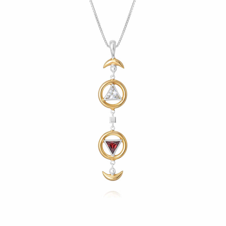 The Resource Pendant by Kaora Sandara Jewelry features two gold-plated crescent moons, two gold circles with crystal and garnet gems, all suspended vertically on a sterling silver chain.
