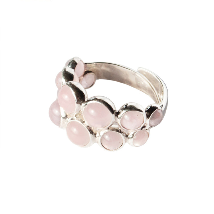 The Silver Ring The Dance with Rose Quartz by Kaora Sandara Jewelry features a cluster of round and oval rose quartz stones in sterling silver, symbolizing spiritual love, shown against a white background.