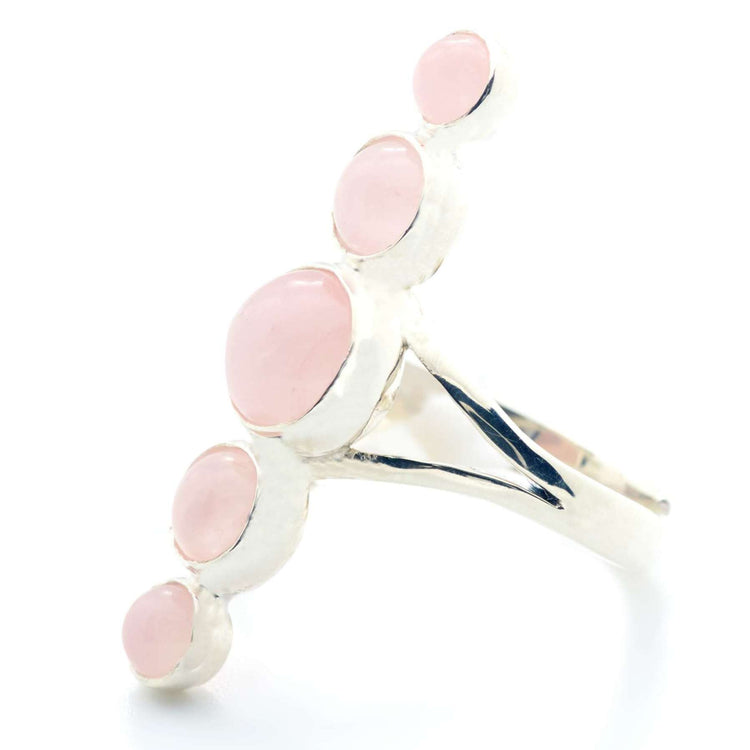 The Silver Ring Harmony by Kaora Sandara Jewelry features five round Rose Quartz sphere gemstones set linearly on a split band, symbolizing universal love and emotional balance, against a plain white background.