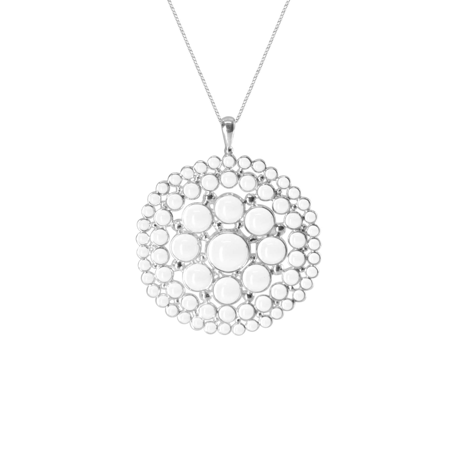 The Purity Pendant - Sterling Silver with Crystal, Size L by Kaora Sandara Jewelry features a round pendant with concentric raised white dots, creating a textured, symmetrical look on a thin chain.