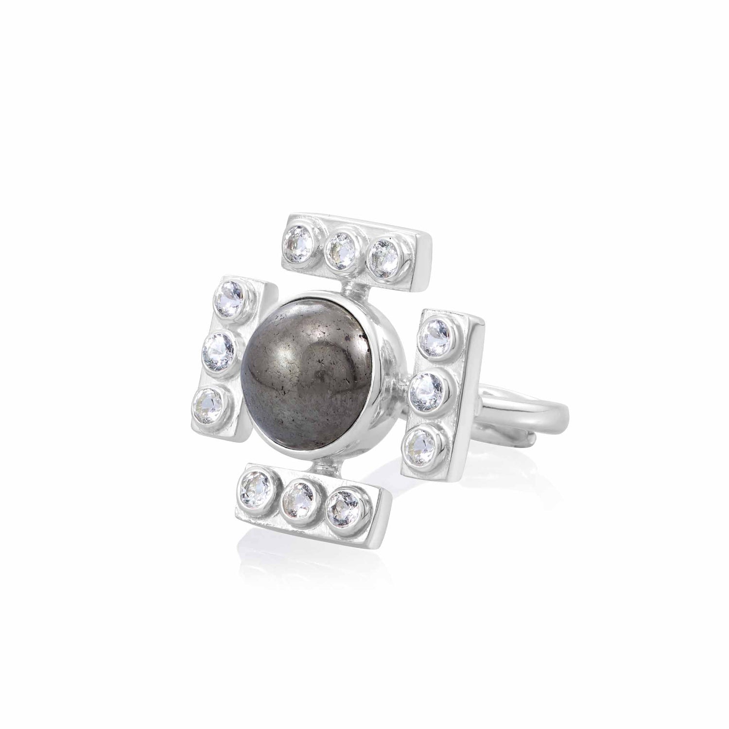The Confidence Ring by Kaora Sandara Jewelry features sterling silver with a central round pyrite stone, accented by four rectangular sections each set with three crystals, creating a bold, cross-inspired design.