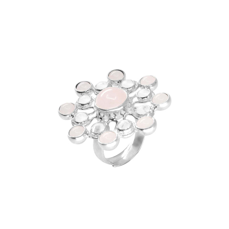 The Source of Love Ring by Kaora Sandara Jewelry features sterling silver, a central rose quartz, and sparkling crystals in a delicate floral motif—a symbol of love and elegance.