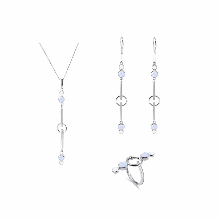 The State Pendant sterling silver set by Kaora Sandara Jewelry features a necklace, drop earrings, and ring with crystal and light blue chalcedony in minimalist geometric designs for a serene look.